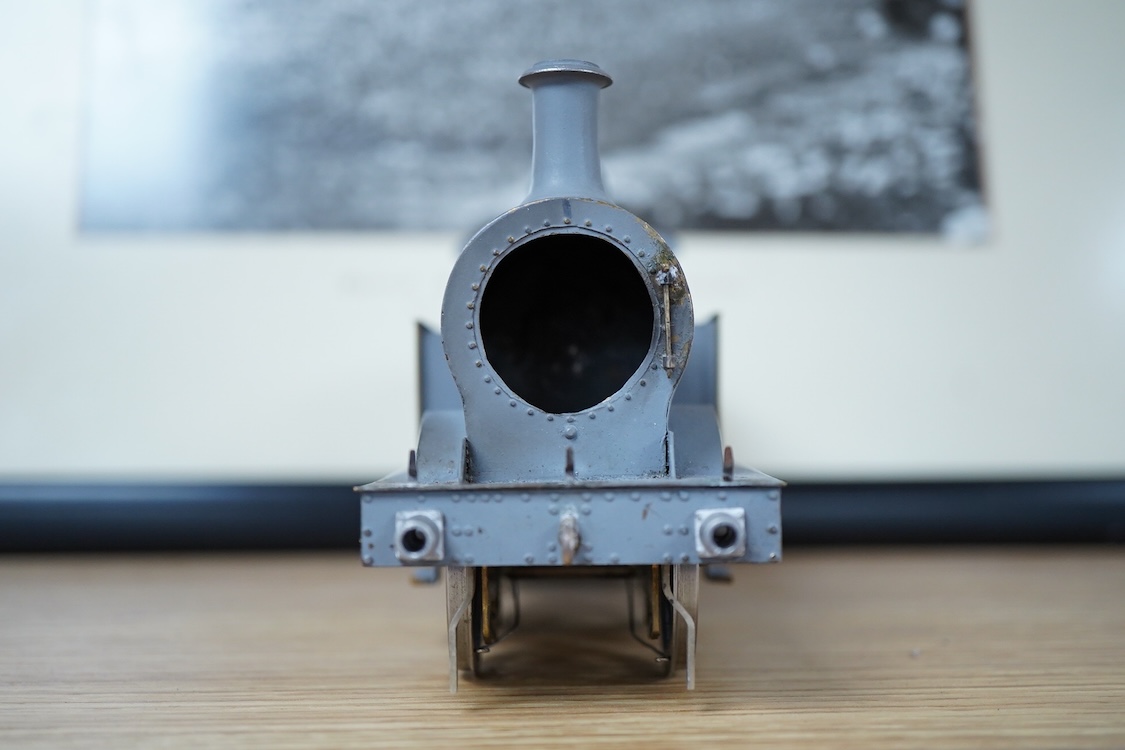 Eleven 0 gauge model railway items including; a bogie stake wagon, two mineral wagons, a North British coal wagon and two further open wagons, a partly constructed brake van, together with a Lima LMS 4F locomotive, two L